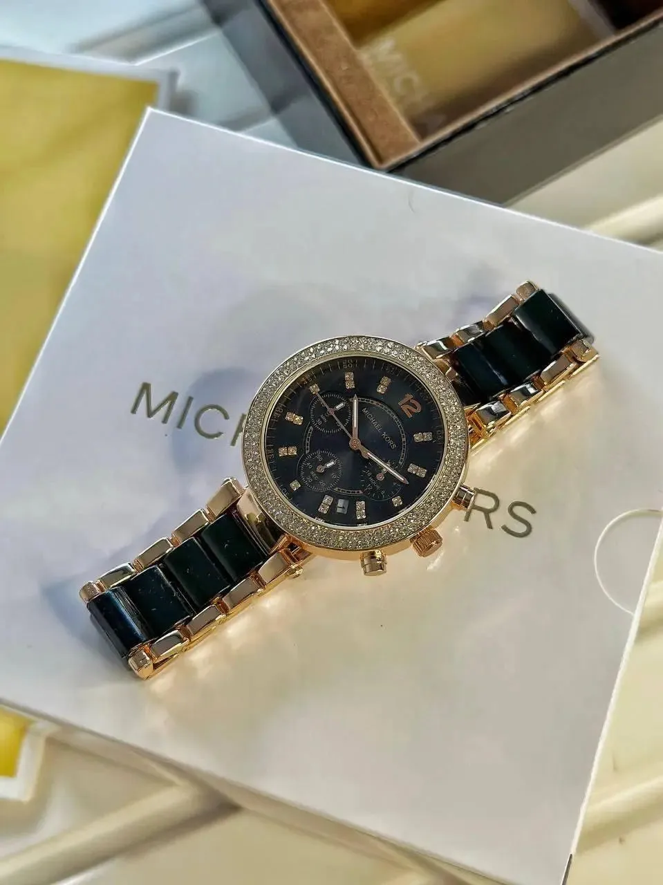 Michael Kors For Her Black  Perfectly made for outgoing and active ladies, this Michael Kors modern and stylish watch would be a great accessory for you.